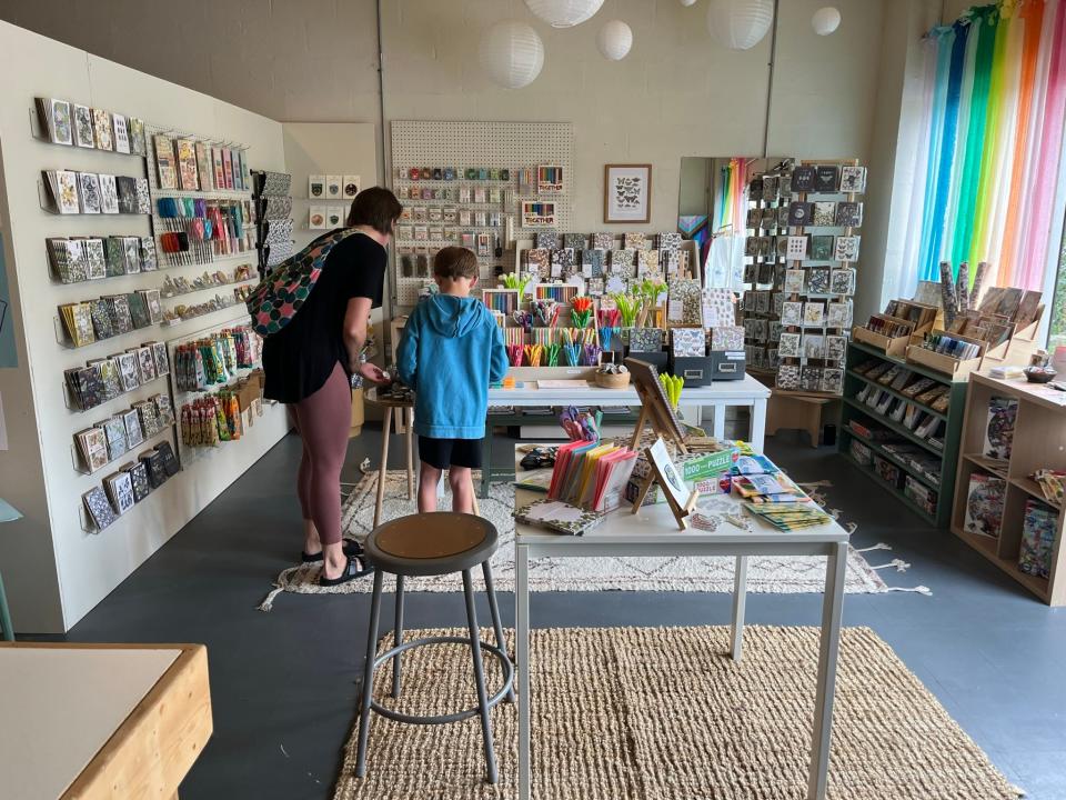 Artist and nature lover Jessie Tyree Jenness has built Root & Branch Paper Co. from a dining table operation into a successful wholesale business with a brick-and-mortar shop in Parkridge. Here, textile artist Melissa Everett and her son Cole browse the wares. June 22, 2023