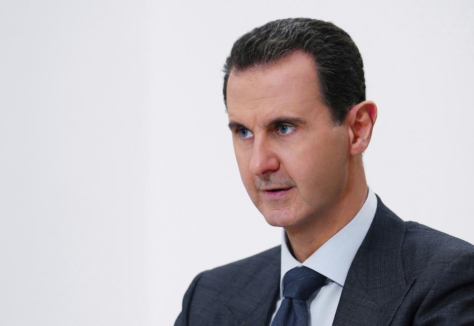 FILE - In this photo released on Nov. 9, 2019 by the Syrian official news agency SANA, Syrian President Bashar Assad speaks in Damascus, Syria. Syria's embattled President Bashar Assad has received late Monday, May 15, 2023 an invitation to attend the upcoming COP28 climate talks in Dubai later this year, even as the yearslong war in his country over his rule grinds on. (SANA via AP, File)