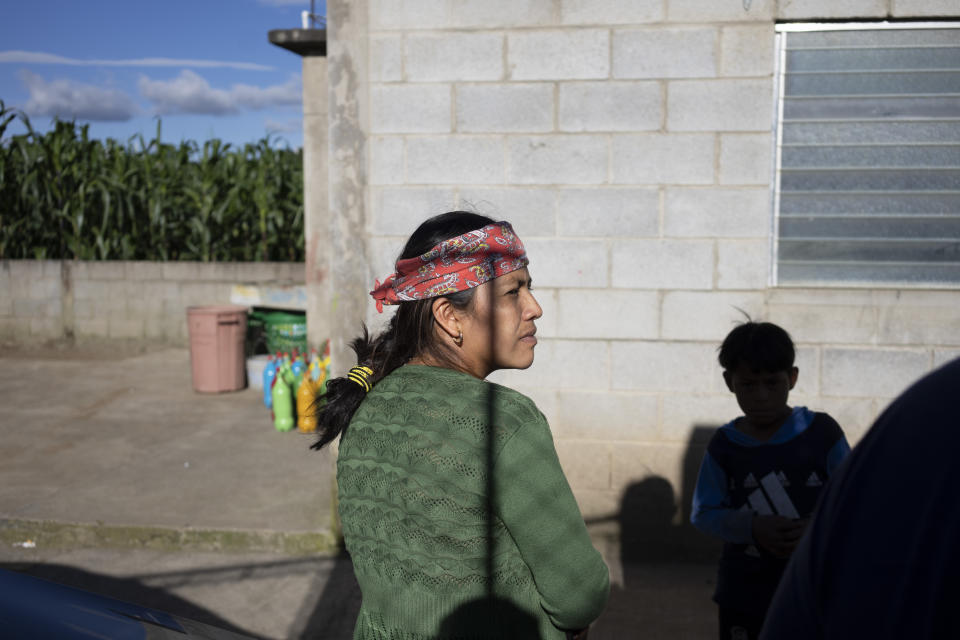 Maria Sipac Coj, mother of Pascual Melvin Guachiac, waits for the start of a community meeting in Tzucubal, Guatemala, Wednesday, June 29, 2022. Pascual and his cousin Wilmer Tulul, both 13, were among the dead discovered inside a tractor-trailer near auto salvage yards on the edge of San Antonio, Texas, on Monday, in what is believed to be the nation's deadliest smuggling episode on the U.S.-Mexico border. (AP Photo/Moises Castillo)