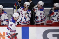 New York Rangers center Ryan Strome (16) celebrates his goal at the bench during the second period of an NHL hockey game against the Washington Capitals, Saturday, Feb. 20, 2021, in Washington. (AP Photo/Nick Wass)