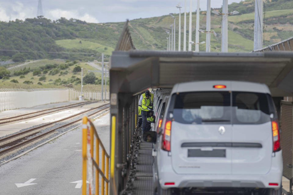 Newly produced vehicles are loaded on a highway before their transport, outside a Renault factory on the outskirts of Tangier, Morocco, Monday, April 29, 2024. Morocco has grown into a car manufacturing juggernaut over the past fifteen years, positioning itself strategically between East and West as the automotive industry transitions to electric vehicles. The country supplies more cars to Europe than China, India or Japan through new highways and an expanded port in Tangier. (AP Photo)