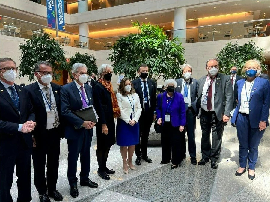 A handout photograph released by the government of Canada shows Canada Deputy Prime Minister & Minister of Finance Chrystia Freeland (C), posing for a photo with other Finance ministers after a multi-nation walk out to protest Russia during a G20 meeting in Washington, DC, on April 20, 2022. US Treasury Secretary Janet Yellen led a multi-nation walk out of a meeting Wednesday of finance officials from the world&#39;s richest countries when Russian officials spoke, in protest against Moscow&#39;s invasion of Ukraine. - RESTRICTED TO EDITORIAL USE - MANDATORY CREDIT 