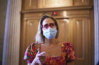 Sen. Kyrsten Sinema, D-Ariz., a centrist Democratic senator vital to the fate of President Joe Biden's $3.5 trillion "Build Back Better" agenda, departs the Senate before meeting with Biden at the White House, at the Capitol in Washington, Tuesday, Sept. 28, 2021. Sinema and fellow moderate, Sen. Joe Manchin, D-W.Va., have balked at the price tag and are now under pressure to show Biden what size package they could live with. (AP Photo/J. Scott Applewhite)