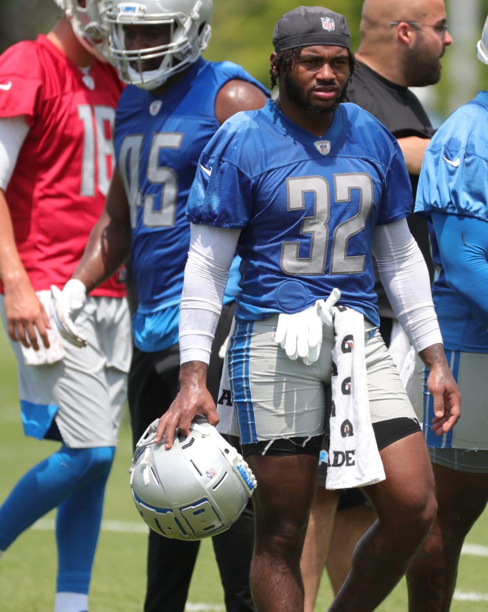 Lions running back D'Andre Swift takes a break during minicamp practice on Wednesday, June 9, 2021, at  the Allen Park practice facility.