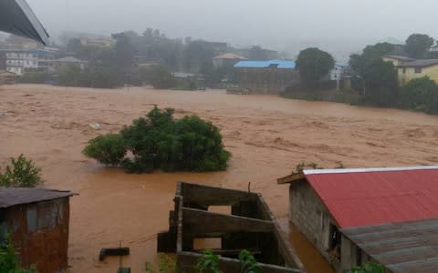 Houses were left submerged in mud after a night of heavy rain that reportedly saw a hillside in the Regent area collapse - Credit: Society for Climate Change Communication Sierra Leone