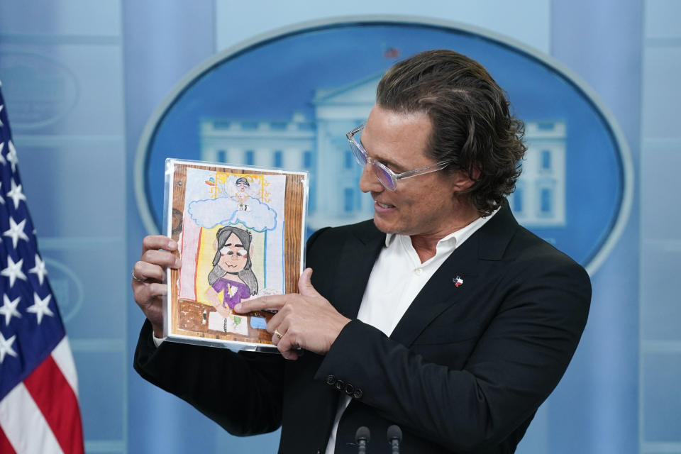 Actor Matthew McConaughey holds a picture made by Alithia Ramirez, 10, who was killed in the mass shooting at an elementary school in Uvalde, Texas, as he speaks during a press briefing at the White House, Tuesday, June 7, 2022, in Washington. (AP Photo/Evan Vucci)