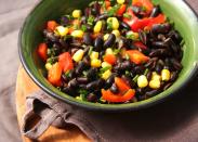 <p>Make black bean salad by tossing 1/2 cup canned black beans, 1/2 cup orange slices, chopped red bell peppers, red onion, scallions and any other desired veggies with 1 teaspoon vinegar. Serve over salad greens and alongside one 100% stone ground corn tortilla and a piece of fruit.</p>