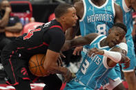 Toronto Raptors guard Norman Powell (24) runs into Charlotte Hornets guard Terry Rozier (3) during the second half of an NBA basketball game Saturday, Jan. 16, 2021, in Tampa, Fla. (AP Photo/Chris O'Meara)