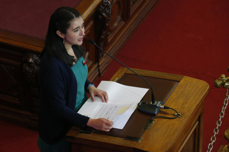 Maria Elisa Quinteros, president of Chile's Constitutional Convention, speaks during a ceremony to deliver a proposed, new constitution for the country during a ceremony at the former Congress in Santiago, Chile, Monday, July 4, 2022. Chileans elected an assembly to write fresh governing principles and put them to a national vote in 2022 with the goal of a more inclusive country and the erasure of a relic of military rule. (AP Photo/Luis Hidalgo)