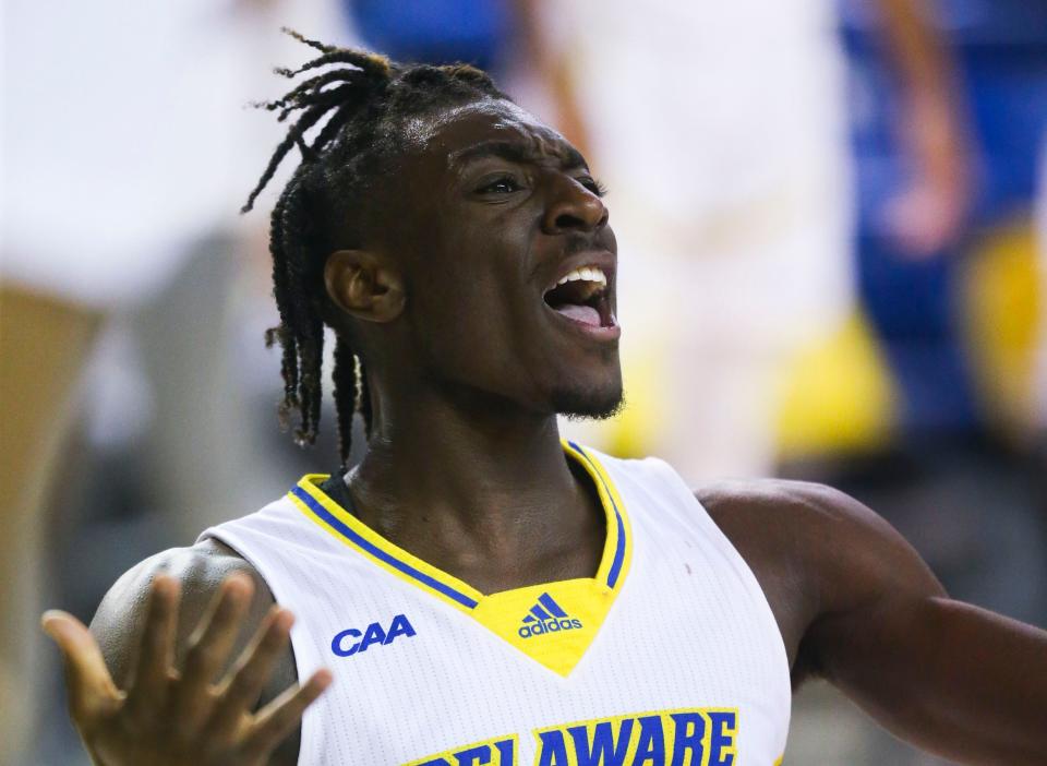 Delaware's Ebby Asamoah reacts after being charged with a foul against Towson in the Blue Hens' 72-59 win at the Bob Carpenter Center, Wednesday, Jan. 11, 2023. The call was reversed after video review,  turning a precarious four-point Delaware lead into an eight-point advantage after Asamoah made his free throws and Delaware retained possession and scored again.