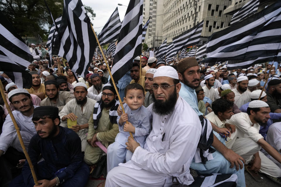 Supporters of a religious group 'Jamiat Ulema-e-Islam-F' party chant slogans during a rally to denounce the burning of Islam's holy book 'Quran,' in Sweden in Karachi, Pakistan, Sunday, July 23, 2023. (AP Photo/Fareed Khan)