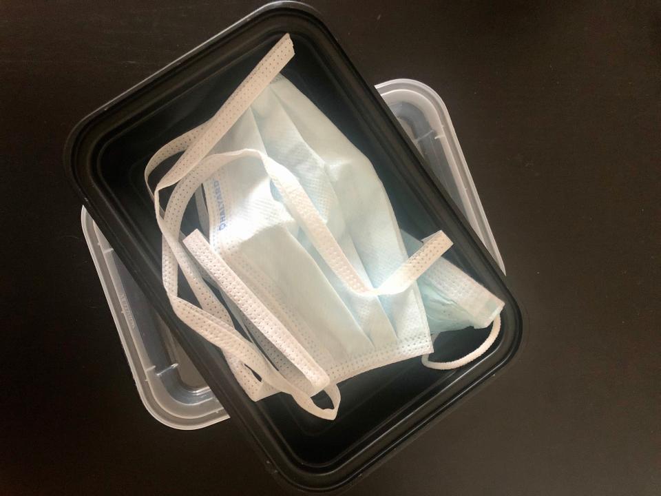 Healthcare workers at hospitals all over the country are told to reuse their PPE, even though the masks were designed for one-time use. Desperate to preserve their supplies, doctors and nurses have started keeping their masks in Tupperware. (Courtesy of Kate Schertz)