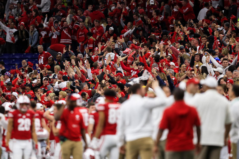 Dec. 7, 2019; Indianapolis, Indiana; Wisconsin Badgers fans react to a touchdown against the Ohio State Buckeyes during the first half in the 2019 Big Ten Championship Game at Lucas Oil Stadium. Aaron Doster-USA TODAY Sports