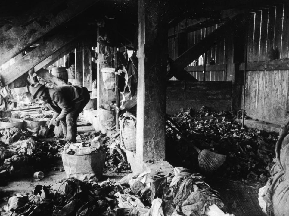 A man sorts through trash in a makeshift home under the 47th Street dump in New York City.