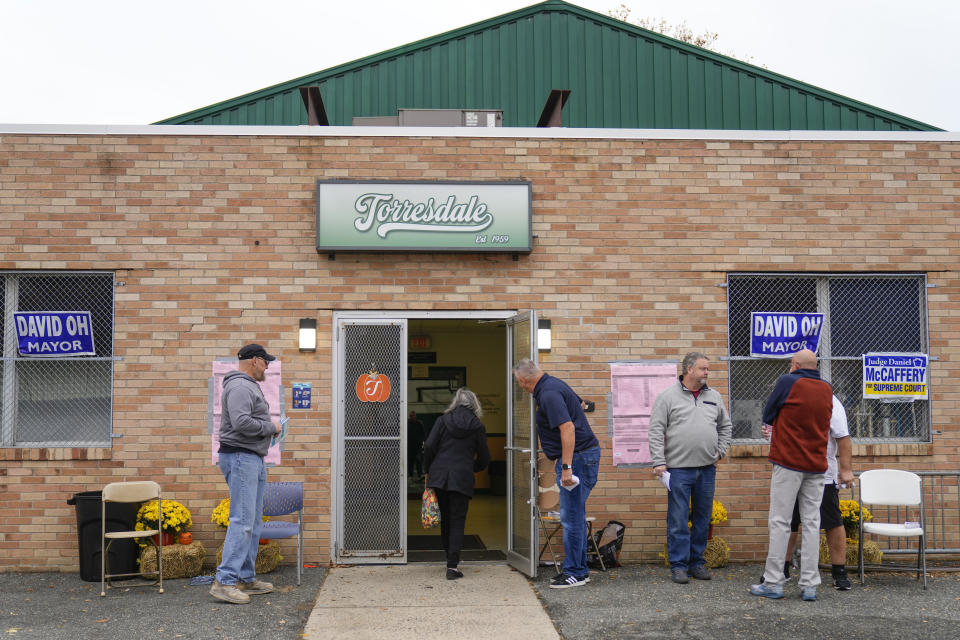 A voter arrives at her polling place on election day in Philadelphia, Tuesday, Nov. 7, 2023. (AP Photo/Matt Rourke)