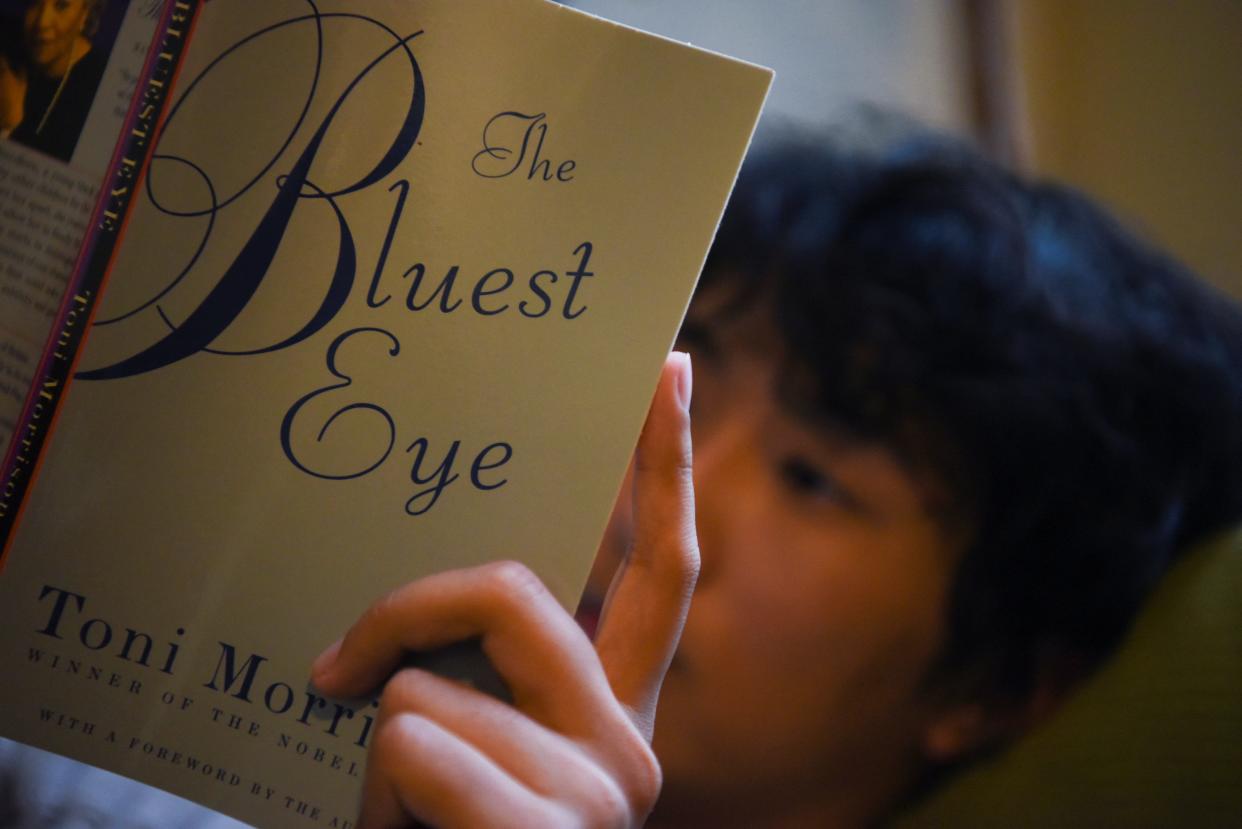 Andrew Lu, 17, a senior at Clements High School in Texas, reads "The Bluest Eye." CALLAGHAN O'HARE, REUTERS