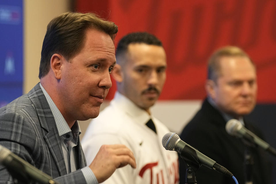 Minnesota Twins' president of baseball operations Derek Falvey, left, takes questions alongside Minnesota Twins' Carlos Correa, center, and agent Scott Boras during a baseball press conference at Target Field Wednesday, Jan. 11, 2023, in Minneapolis. The team and Correa agreed to a six-year, $200 million contract. (AP Photo/Abbie Parr)