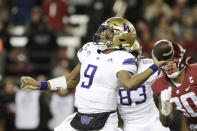 Washington quarterback Michael Penix Jr. (9) throws a pass during the first half of an NCAA college football game against Washington State, Saturday, Nov. 26, 2022, in Pullman, Wash. (AP Photo/Young Kwak)