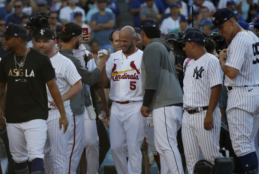 LOS ANGELES, CA - JULY 18, 2022: All- Stars from both teams pay tribute St Louis Cardinals Albert Pujols during the Home Run Derby at Dodger Stadium on July 18, 2022 in Los Angeles, California. (Gina Ferazzi / Los Angeles Times)