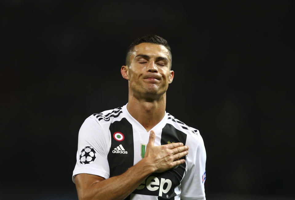 Juventus forward Cristiano Ronaldo gestures at the end of the Champions League group H soccer match between Manchester United and Juventus at Old Trafford, Manchester, England, Tuesday, Oct. 23, 2018. (AP Photo/Dave Thompson)