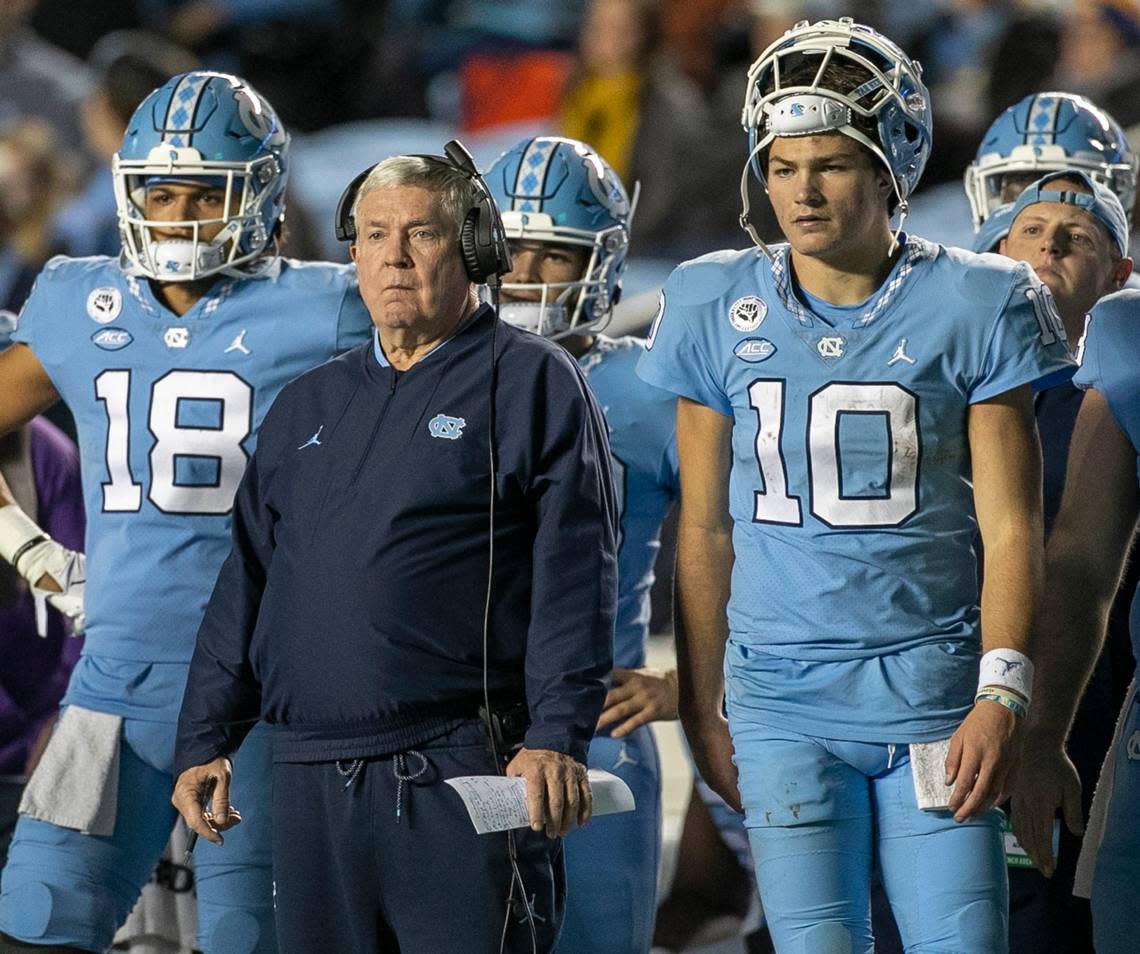 North Carolina quarterback Drake Maye and coach Mack Brown watch the extra point attempt by Noah Burnette to give the Tar Heels a 28-24 lead in the fourth quarter against Pitt on Saturday, October 29, 2022 at Kenan Stadium in Chapel Hill, N.C.