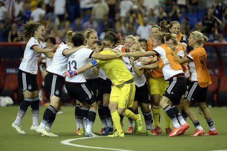 Jun 26, 2015; Montreal, Quebec, CAN; Germany goalkeeper Nadine Angerer (1) celebrates with teammates after making a save on the final penalty kick to defeat France during in penalty kicks during the quarterfinals of the FIFA 2015 Women's World Cup at Olympic Stadium. Mandatory Credit: Eric Bolte-USA TODAY Sports