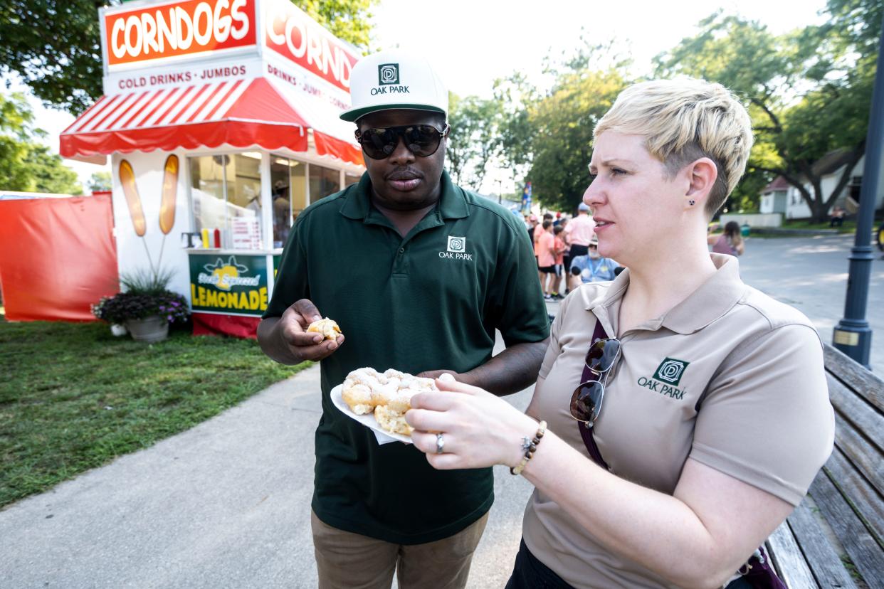 Ian and Jess Robertson taste funnel cake on Day 1 of the Iowa State Fair.