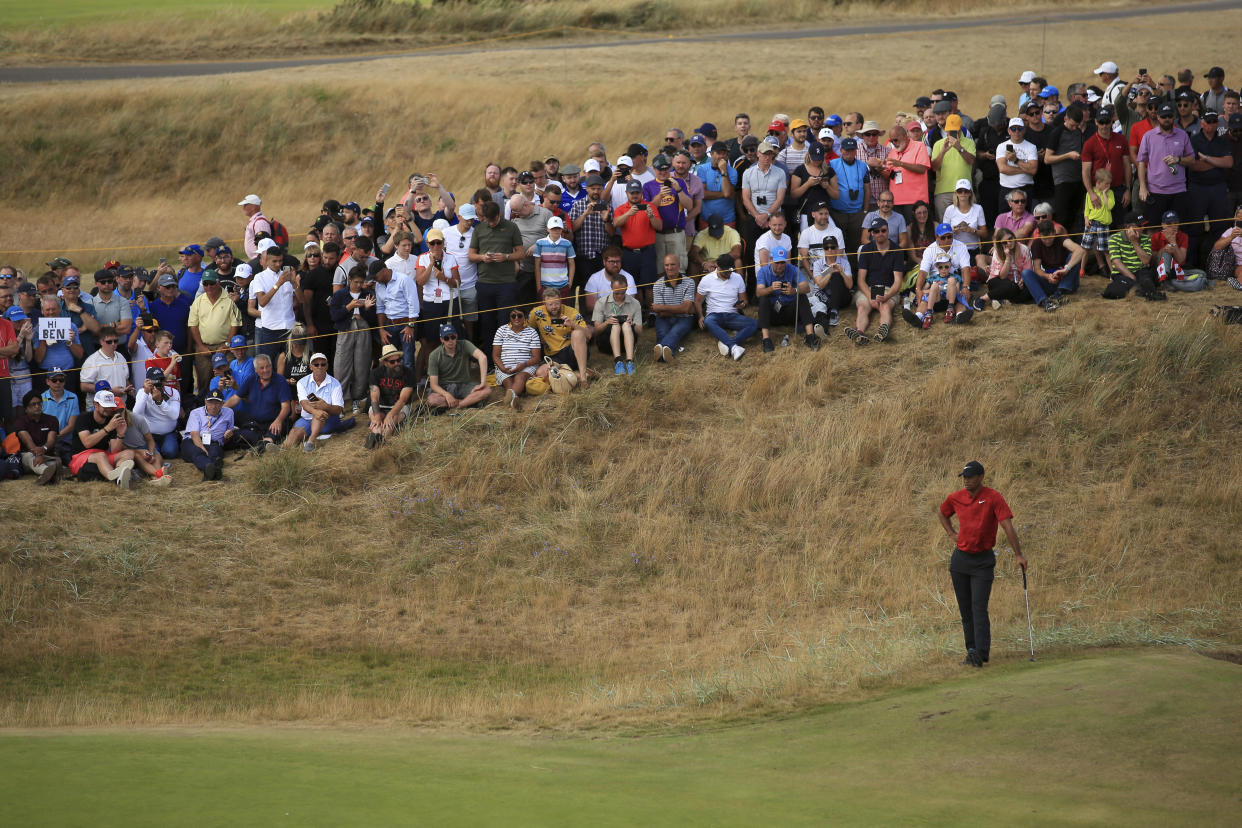 Tiger Woods waits to putt during the final round of the British Open Golf Championship in Carnoustie, Scotland, (AP)