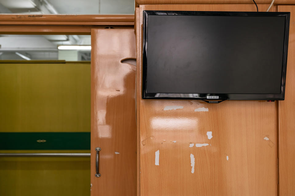 Marks left by tape that once held up family photos, seen in a dormitory space that belonged to a resident who died of COVID-19, Kei Tak (Tai Hang) Home for the Aged, Hong Kong.<span class="copyright">Anthony Kwan for TIME</span>