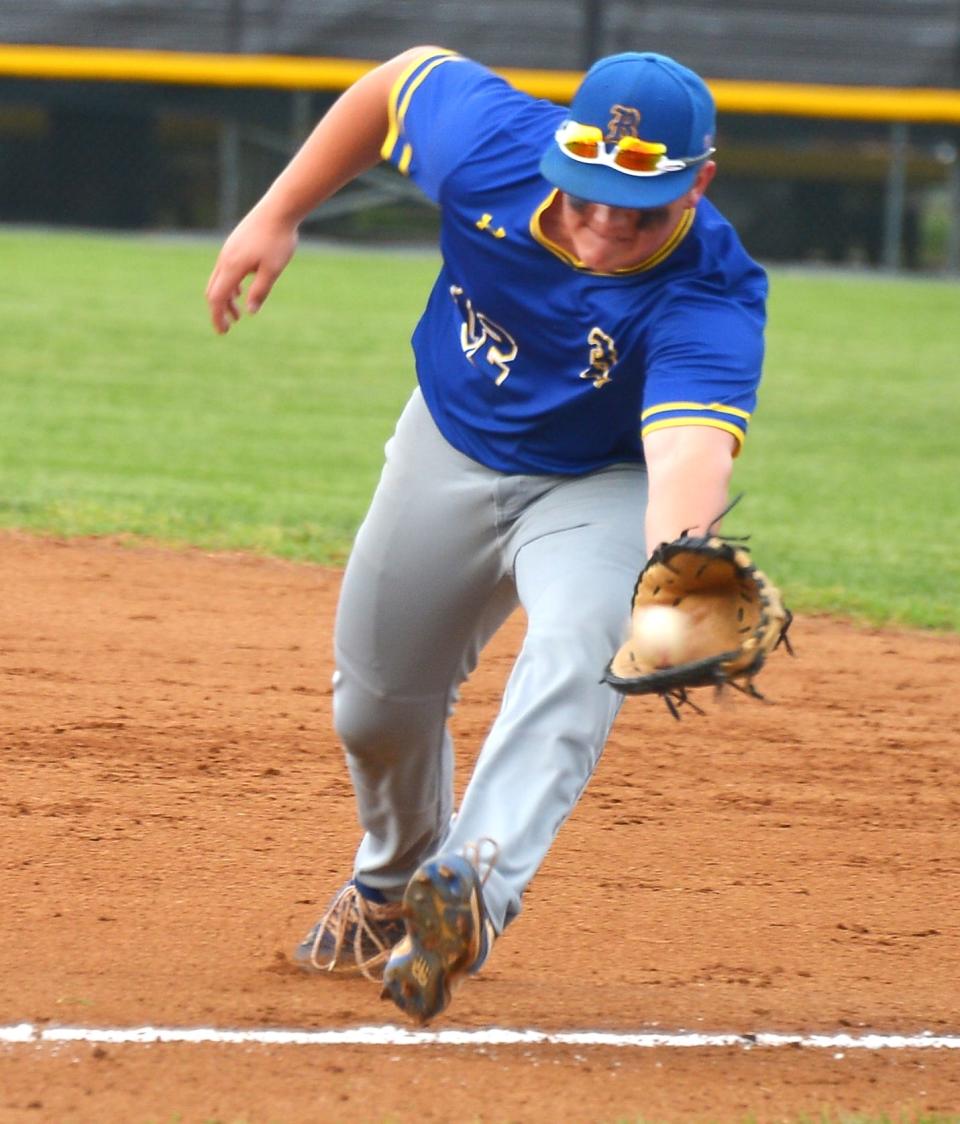 Clear Spring first baseman Logan Helser snags a grounder along the line for the second out of the first inning during the Blazers' 1-0 win in the Class 1A semifinals.