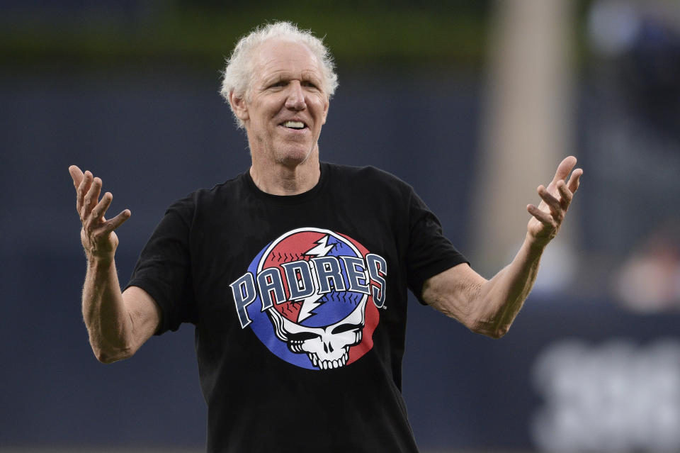 FILE - Former basketball player and sportscaster Bill Walton gestures after throwing out the ceremonial first pitch before a baseball game between the San Diego Padres and the Colorado Rockies Thursday, Aug. 8, 2019, in San Diego. Bill Walton might have been the ultimate San Diegan. While he went away to play basketball at UCLA as well as the bulk of his NBA career, he never missed a chance to celebrate his hometown. (AP Photo/Orlando Ramirez, File)