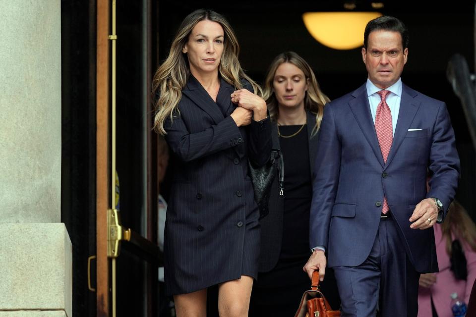 Karen Read, left, leaves Norfolk Superior Court with her attorney Alan Jackson, right, after the opening day of her trial, Monday, April 29, 2024, in Dedham, Mass. Read is charged with killing her Boston police officer boyfriend by intentionally driving her SUV into him. (AP Photo/Charles Krupa)