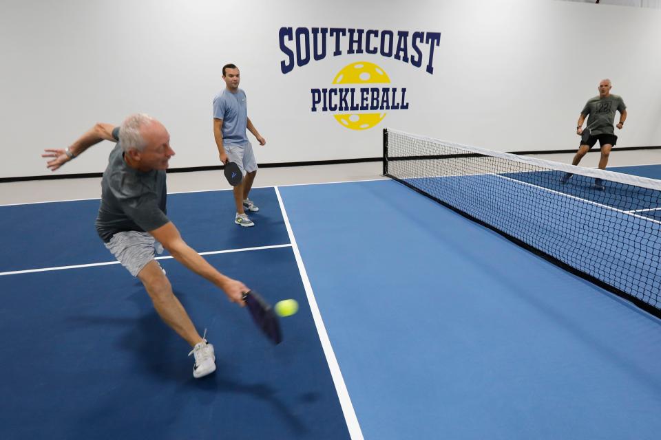 Ray St.Amand digs for a return during a match at the newly opened Southcoast Pickleball indoor courts in Fairhaven.