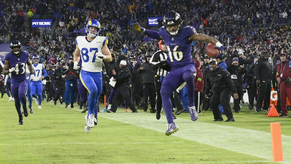 Wallace starts to celebrates as he returns a punt for a game-winning touchdown against the Rams. - Nick Wass/AP