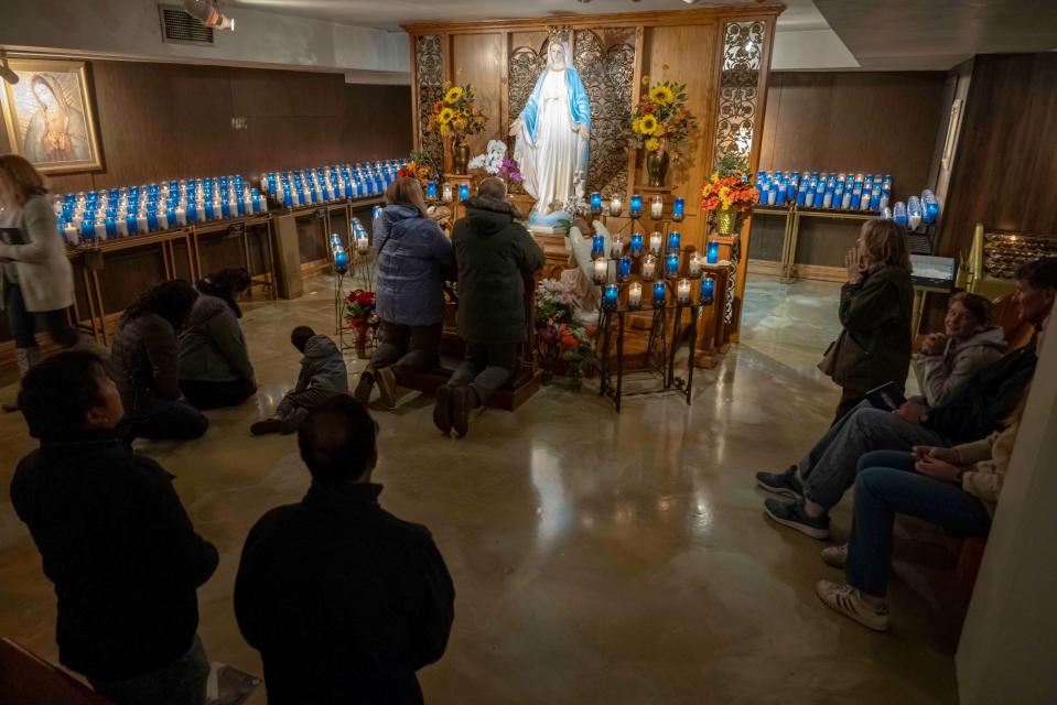 People pray at The National Shrine of Our Lady of Champion