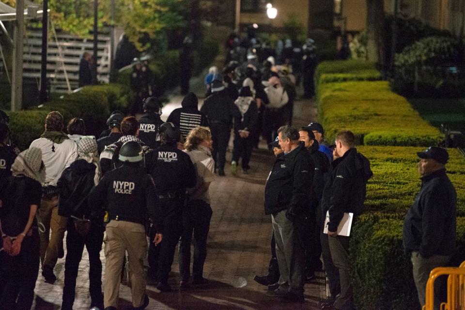 Officers with the New York Police Department arrest pro-Palestinian protesters at Columbia University (AP)