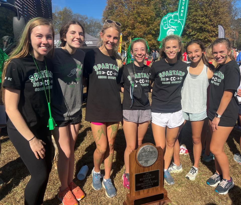 Webb girls celebrate a second place finish in cross country at the state meet.