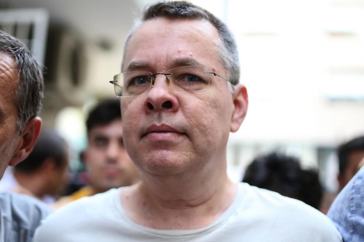 US pastor Andrew Craig Brunson, here escorted by plain clothes police officers on his transfer from prison to house arrest on 25 July 2018 in Izmir, Turkey: AFP