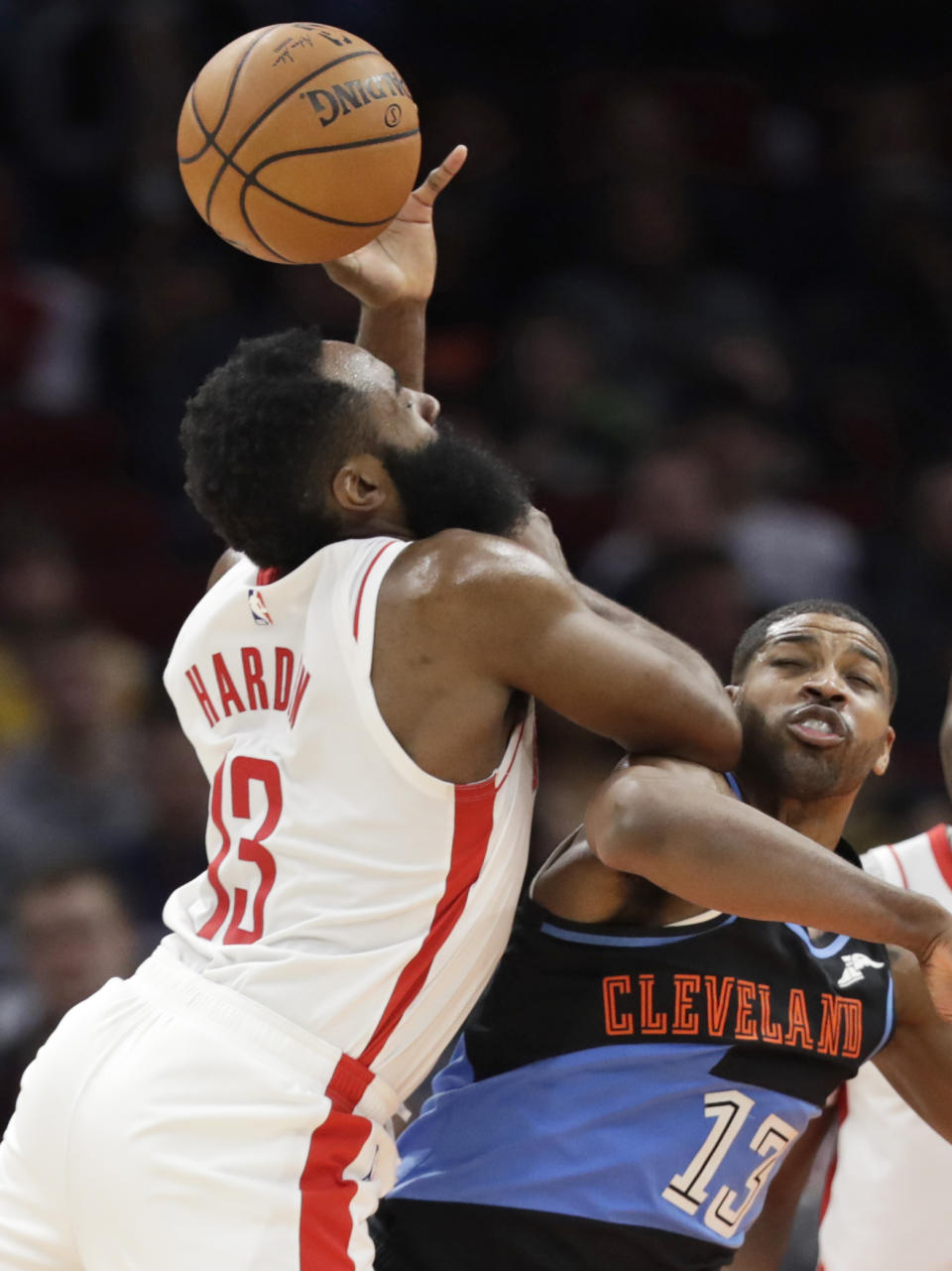 Houston Rockets' James Harden, left, and Cleveland Cavaliers' Tristan Thompson battle for a rebound in the second half of an NBA basketball game, Wednesday, Dec. 11, 2019, in Cleveland. Houston won 116-110. (AP Photo/Tony Dejak)