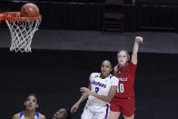 Louisville's Hailey Van Lith (10) watches her 3-point basket go in, next to DePaul's Deja Church (3) during the second half of an NCAA college basketball game Friday, Dec. 4, 2020, in Uncasville, Conn. (AP Photo/Jessica Hill)
