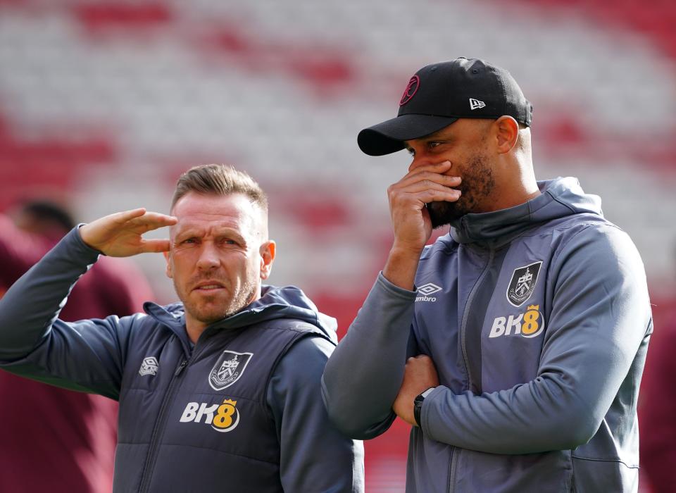 Vincent Kompany, right, with coach Craig Bellamy at Anfield (PA)