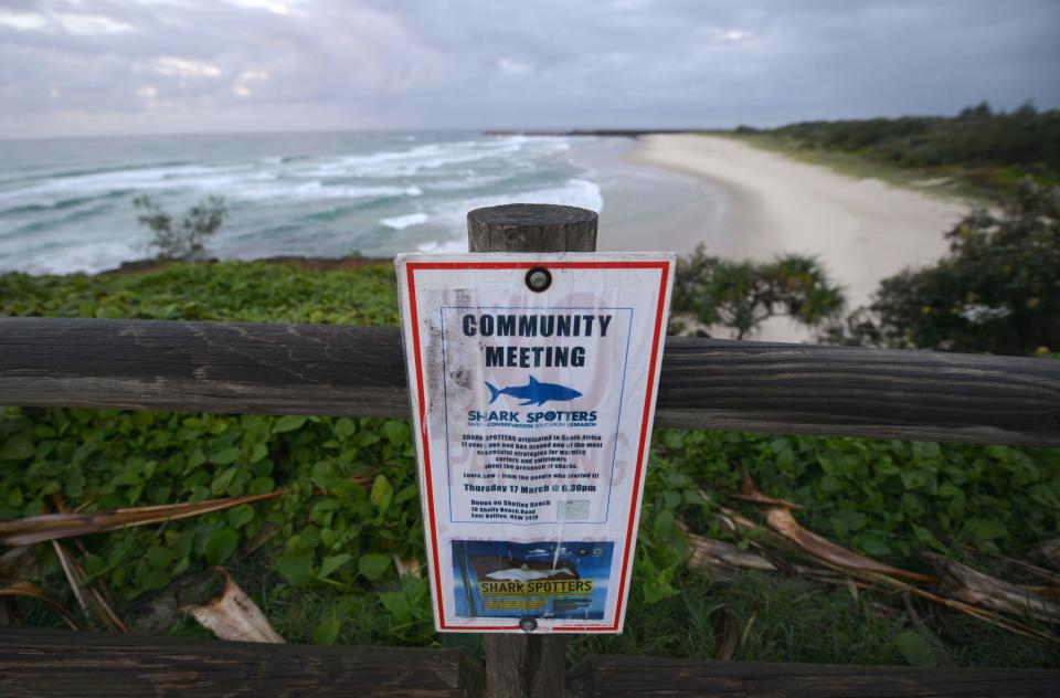 This photo taken on April 29, 2016 shows a sign about a shark spotters meeting at Lighthouse Beach in Ballina in northern New South Wales.  / Credit: PETER PARKS/AFP via Getty Images