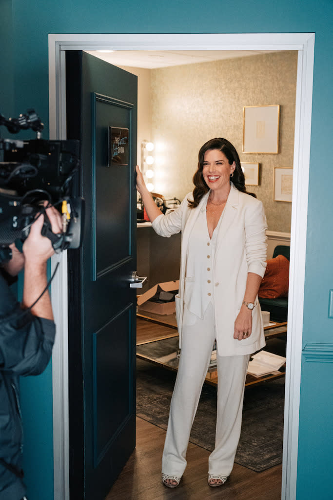 Neve Campbell wears a white suit at “The Late Late Show With James Corden” in Los Angeles on Jan. 18, 2022. - Credit: CBS