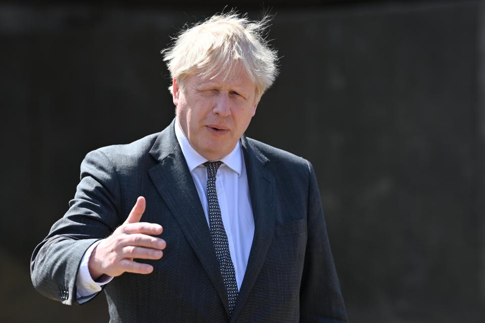 Prime Minister Boris Johnson walking outdoors (PA Wire)