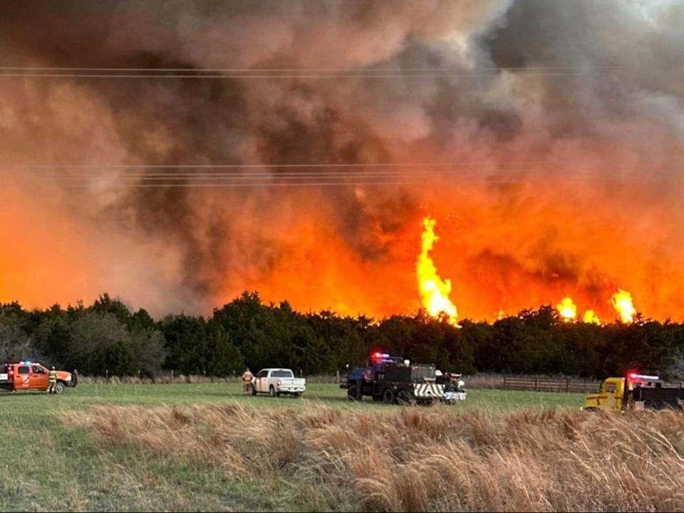Firefighters and emergency responders at the scene of a wildfire in Woodward County, Oklahoma, on Sunday 7 April, 2024 (Chris Pinkston and Jason Lawrence / Vici Fire Department)