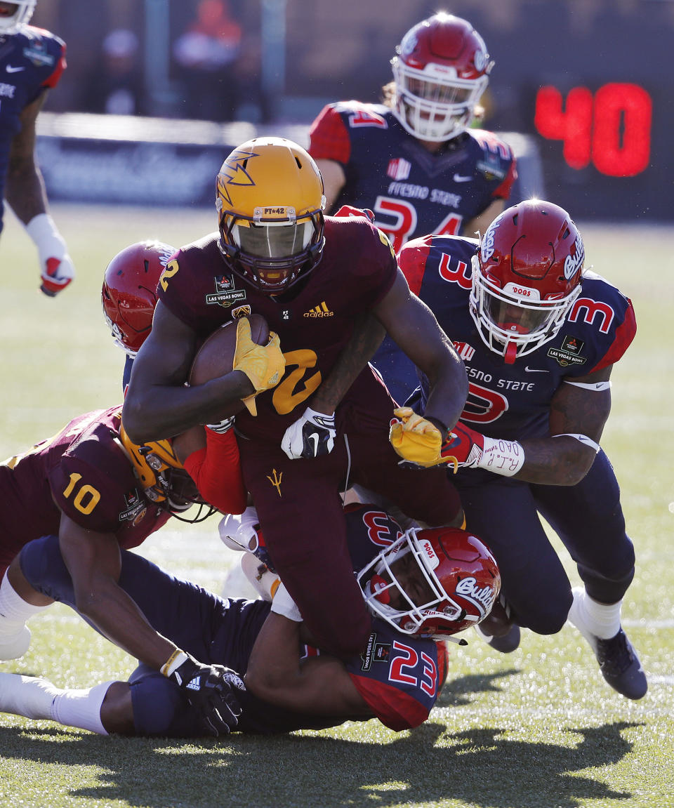 Arizona State wide receiver Brandon Aiyuk is tackled after making a gain against Fresno State during the first half of the Las Vegas Bowl NCAA college football game, Saturday, Dec. 15, 2018, in Las Vegas. (AP Photo/John Locher)