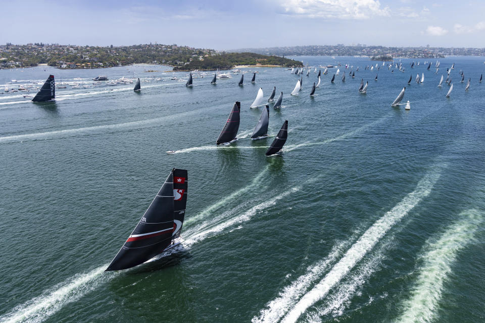 Competitors sail through Sydney Harbour to begin the Sydney Hobart yacht race in Sydney, Tuesday, Dec. 26, 2023. The 630-nautical mile race has more than 100 yachts starting in the race to the island state of Tasmania. (Andrea Francolini/Rolex/CYCA via AP)