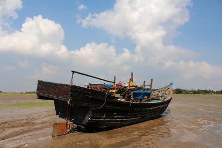 A stranded boat which was used by Rohingya Muslims is seen at the Thande village beach outside Yangon, Myanmar November 16, 2018. REUTERS/Myat Thu Kyaw