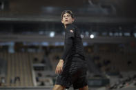 Austria's Dominic Thiem looks back in the first round match of the French Open tennis tournament against Croatia's Marin Cilic at the Roland Garros stadium in Paris, France, Monday, Sept. 28, 2020. (AP Photo/Alessandra Tarantino)