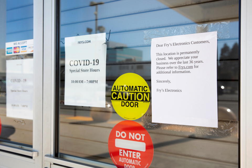 Signs stating the store's permanent closure are posted on the front door at a Fry's Electronics store, after the chain announced that they would cease operations and close all branches due to changing retail conditions and challenges posed by the coronavirus pandemic, in Concord, California, U.S. February 24, 2021.  REUTERS/Brittany Hosea-Small